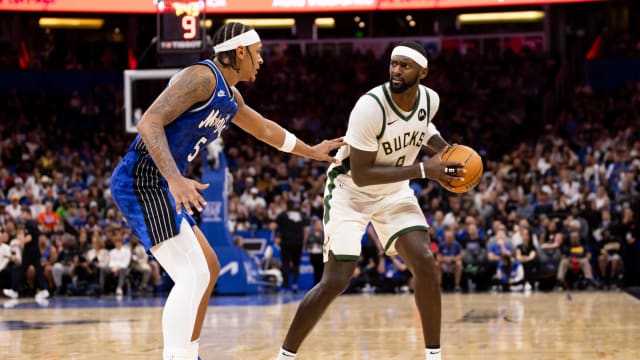 Orlando Magic forward Paolo Banchero (5) defends Milwaukee Bucks forward Bobby Portis (9)